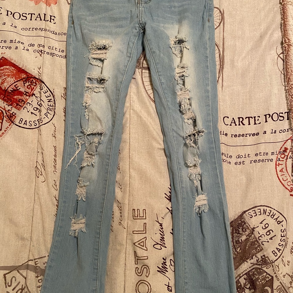 Light blue ripped jeans